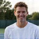 Portrait of Coach Mark Johnson, looking approachable and energetic.